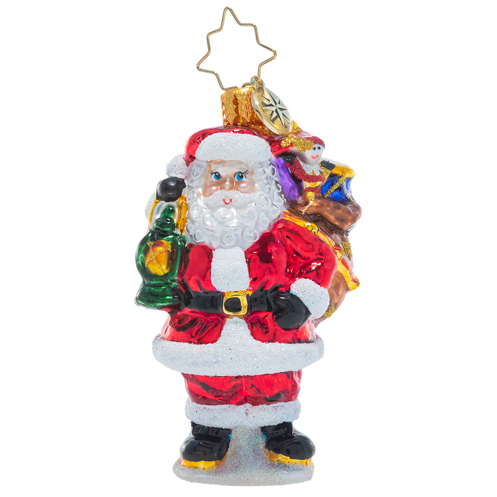 Front - Ornament Description - Our Gallant Guide Gem: Light the way, Santa! Saint Nick presses on to deliver a sack full of Christmas treasure to every good girl and boy.