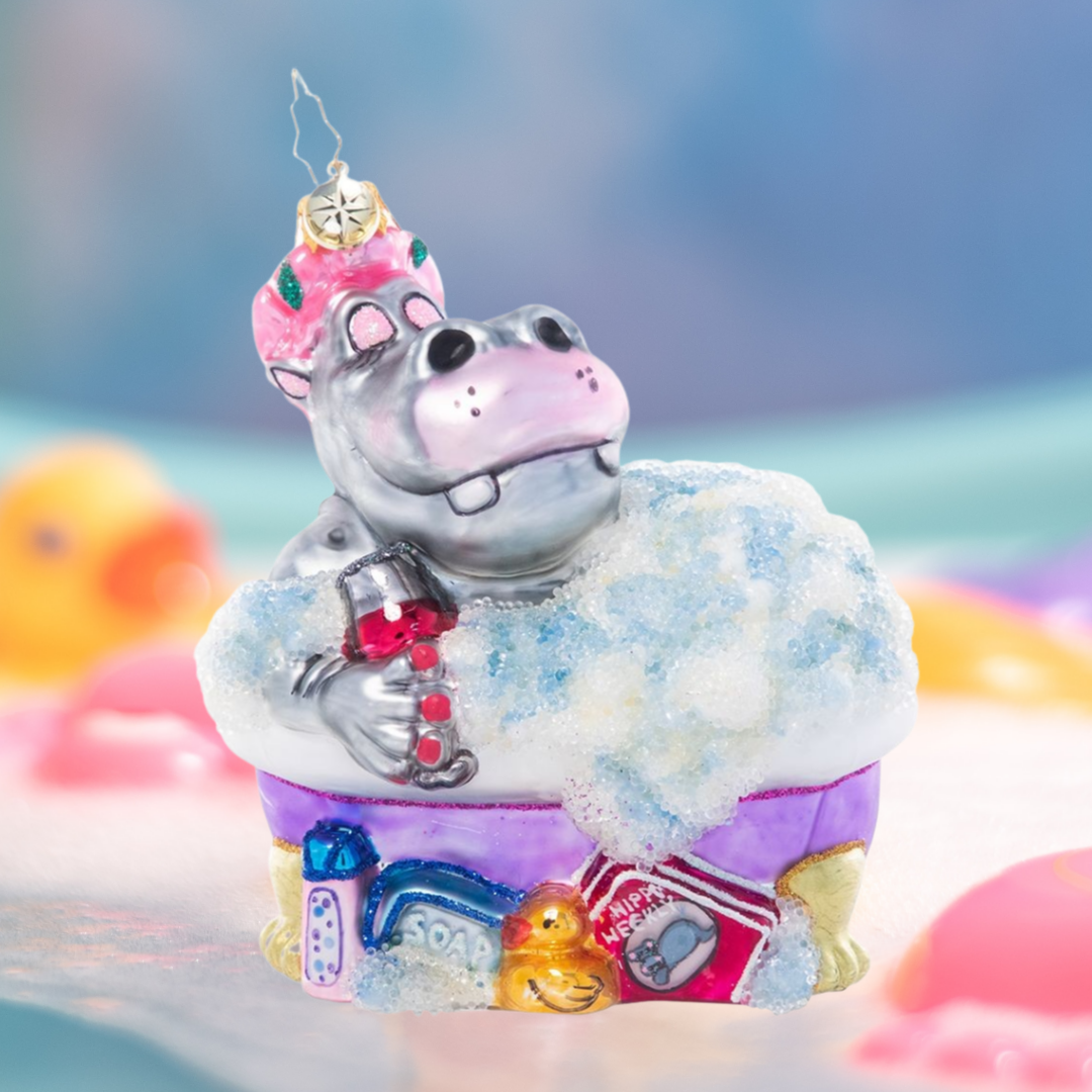 Ornament Description - Bathtime Bubbles: Splish splash! This happy hippo is treating herself to some seriously stylin' self-care in a relaxing bubble bath.