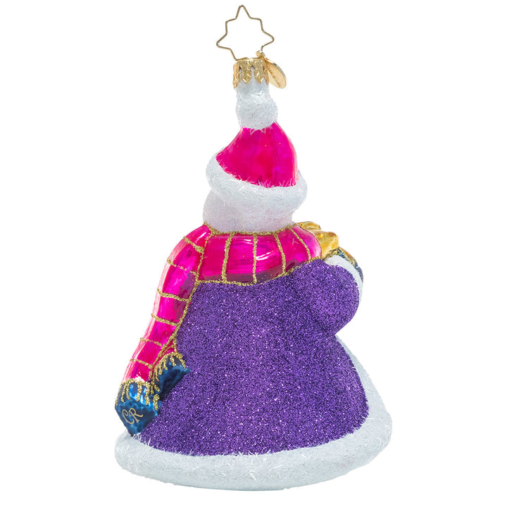 Back - Ornament Description - Smilin' And Stylin': This cheerful snowman has chosen some fabulous finery to guard him against the chill of winter as he travels to share a gift with a friend. He knows no ensemble is complete without a sparkly cloak and vibrant accessories. This snowman is certainly celebrating the holidays with his own unique flair!