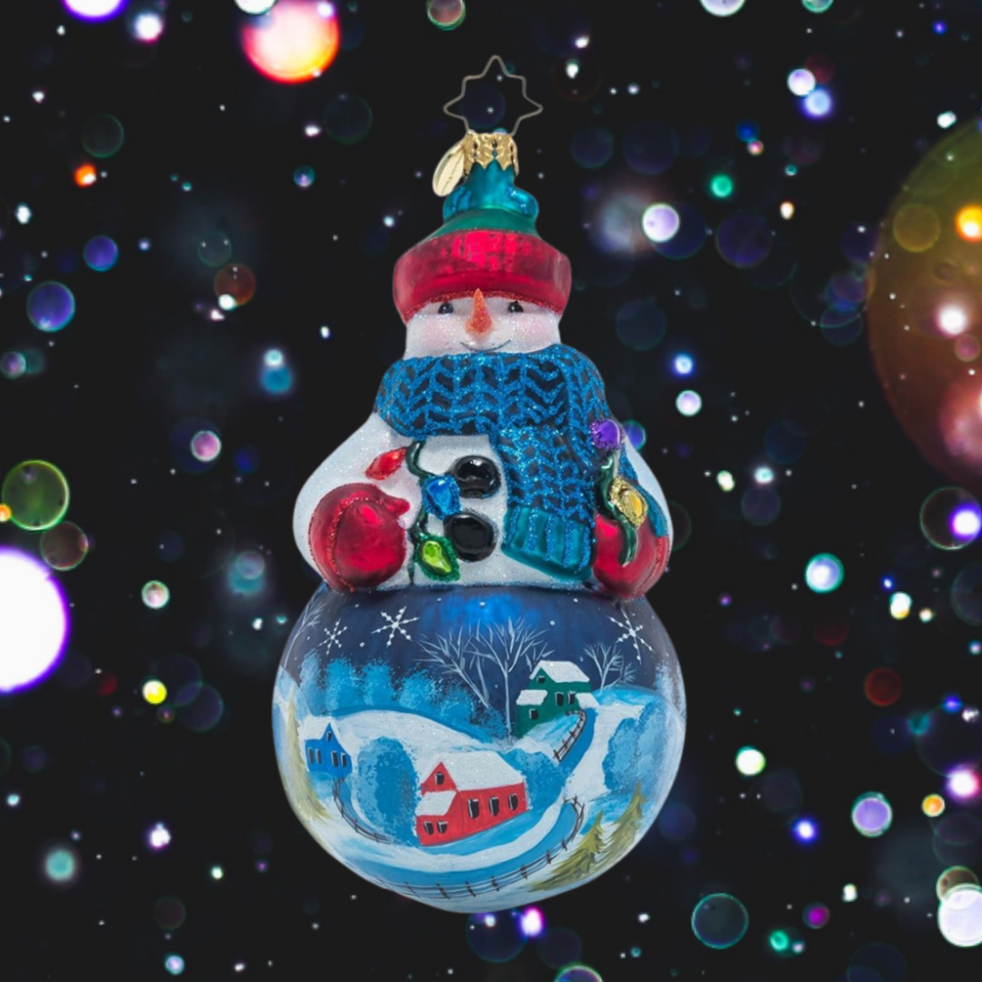 Ornament Description - Winter's Snowy Scene: Mr. Snowman is dressed for the weather in his favorite wintertime accessories that allow him to show off the snow-covered countryside landscape painted on his belly. Bundle up, buddy!