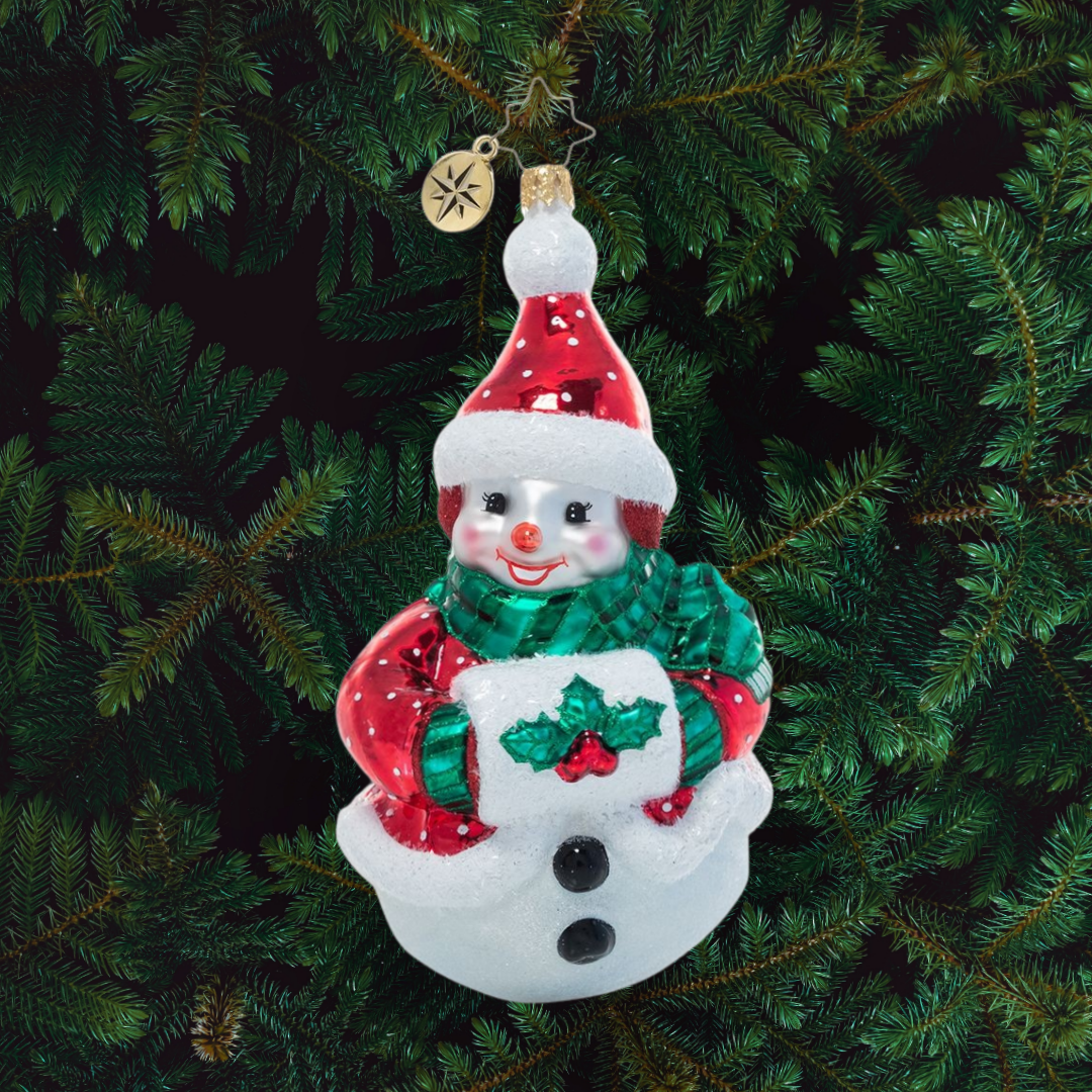 Ornament Description - Holly Jolly Snowman: 'Tis the season to smile and this cheerful snow friend is very happy to see you! He's bundled up against the frosty air in some festive furs and a holly muff.