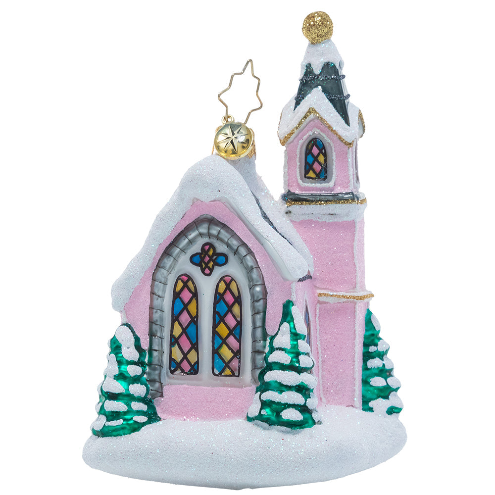 Back - Ornament Description - Enchanting Chapel: The warm glow of this charming pink chapel calls to visitors from far and wide and welcomes them in from the winter cold. What better way to celebrate Christmas than at a place that makes you feel right at home?