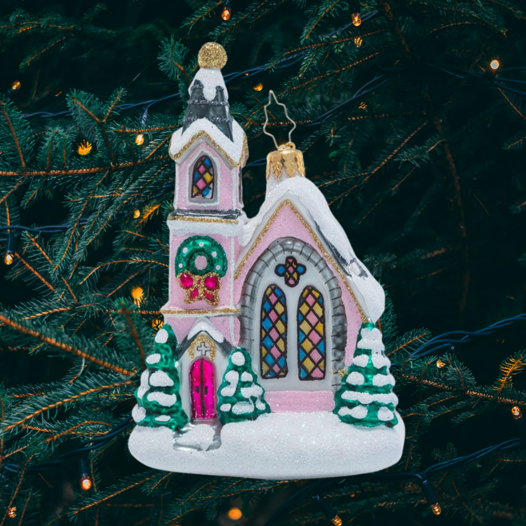 Ornament Description - Enchanting Chapel: The warm glow of this charming pink chapel calls to visitors from far and wide and welcomes them in from the winter cold. What better way to celebrate Christmas than at a place that makes you feel right at home?