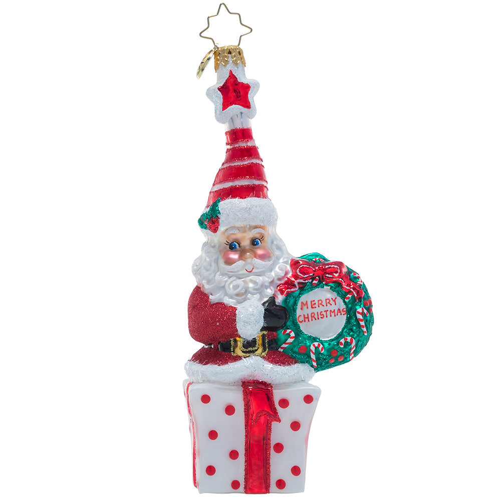 Front - Ornament Description - Vintage Vibrance: This cheery little Saint Nick wishes you a very Merry Christmas! Dressed in glittering ruby red and an extra-festive Santa cap, this jolly elf is ready to celebrate the season.