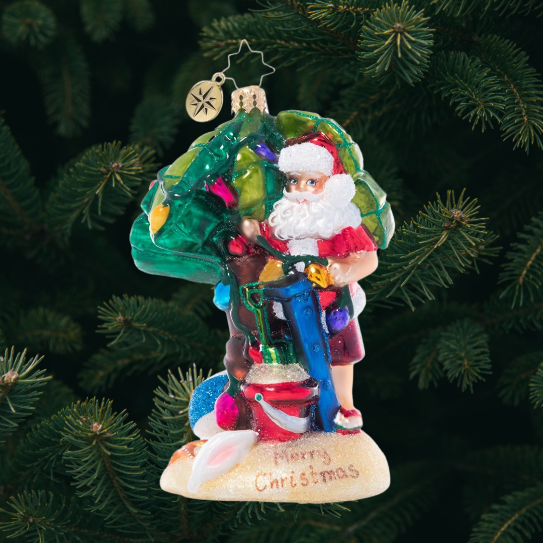 Ornament Description - Sandy Claus: Santa's officially out of office! He's packed a beach bag and escaped to the islands for a little fun in the sun after a very busy Christmas season.