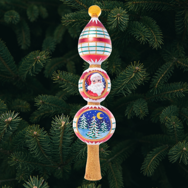 Finial Description - Festive and Folksy Finial: Top your tree with this candy-striped finial. Decorated with two classic Christmas vignettes – Santa Claus and a snowy night in the woods.