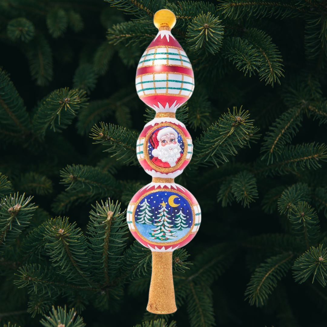 Finial Description - Festive and Folksy Finial: Top your tree with this candy-striped finial. Decorated with two classic Christmas vignettes – Santa Claus and a snowy night in the woods.