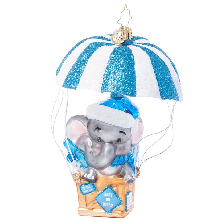 Front - Ornament Description - Bundle of Joy Baby: Baby on board! Welcome the newest little one in your life with this adorable ornament featuring a sweet baby elephant floating in on a blue and white air mail parachute.