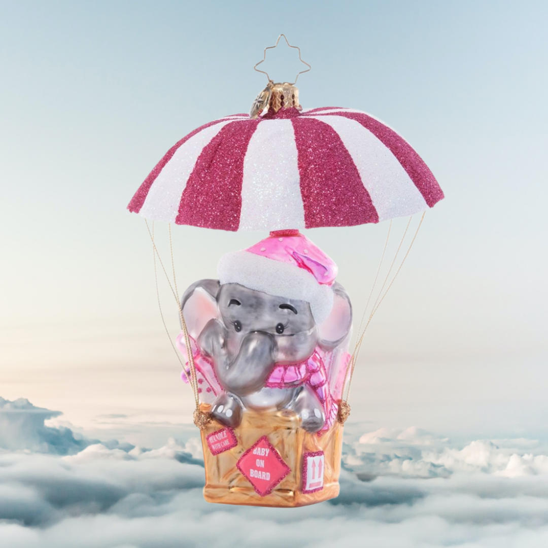 Ornament Description - Sugar and Spice Baby: Special Delivery! Celebrate your new arrival with this darling ornament featuring an adorable baby elephant floating in on a shimmering pink and white air mail parachute.