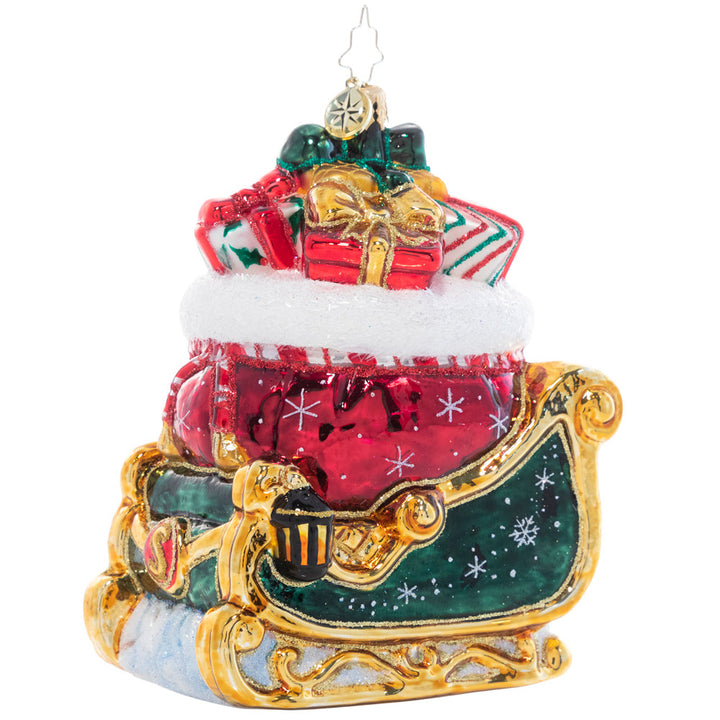 Back Side View - Ornament Description - Christmas Magic Sleight: Painted in the rich colors of the season and bursting with Christmas treasure, the sight of this gilded sleigh is enough to make a believer out of even the most stubborn skeptic!