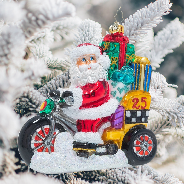 Ornament Description - Pedal Pusher: Beep beep, coming through! Santa's taking to the streets on his pedicab piled high with all his Christmas deliveries.
