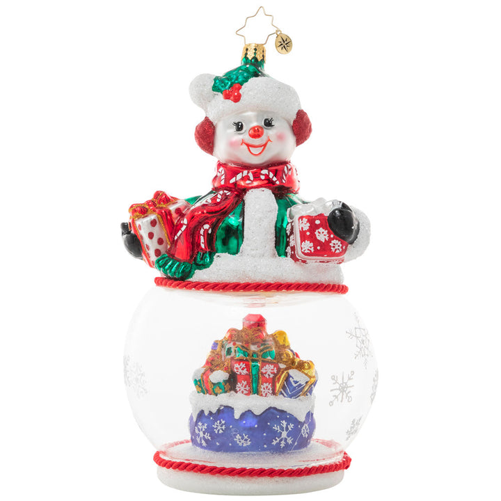 Ornament Description - Chilly and Cheery: This jolly snowman is ready for Christmas! As he proudly shows off his lovingly-wrapped packages, we see there's more where that came from inside his snow globe base!