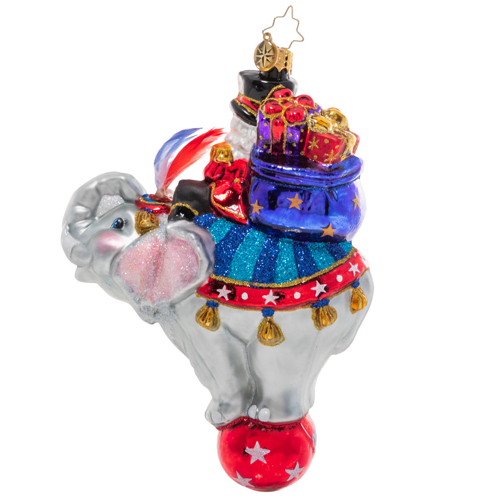 Back - Ornament Description - Ringmaster Claus: Step right up! Santa's no stranger to running the show so it only makes sense that he'd be master of his own circus! He smiles from atop a talented elephant performer on the night of the big show.
