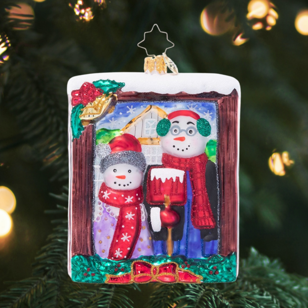Ornament Description - A Moment in Time: Say cheese! This snow couple gives us their chillier--and cheerier!-- version of the iconic American Gothic painting.