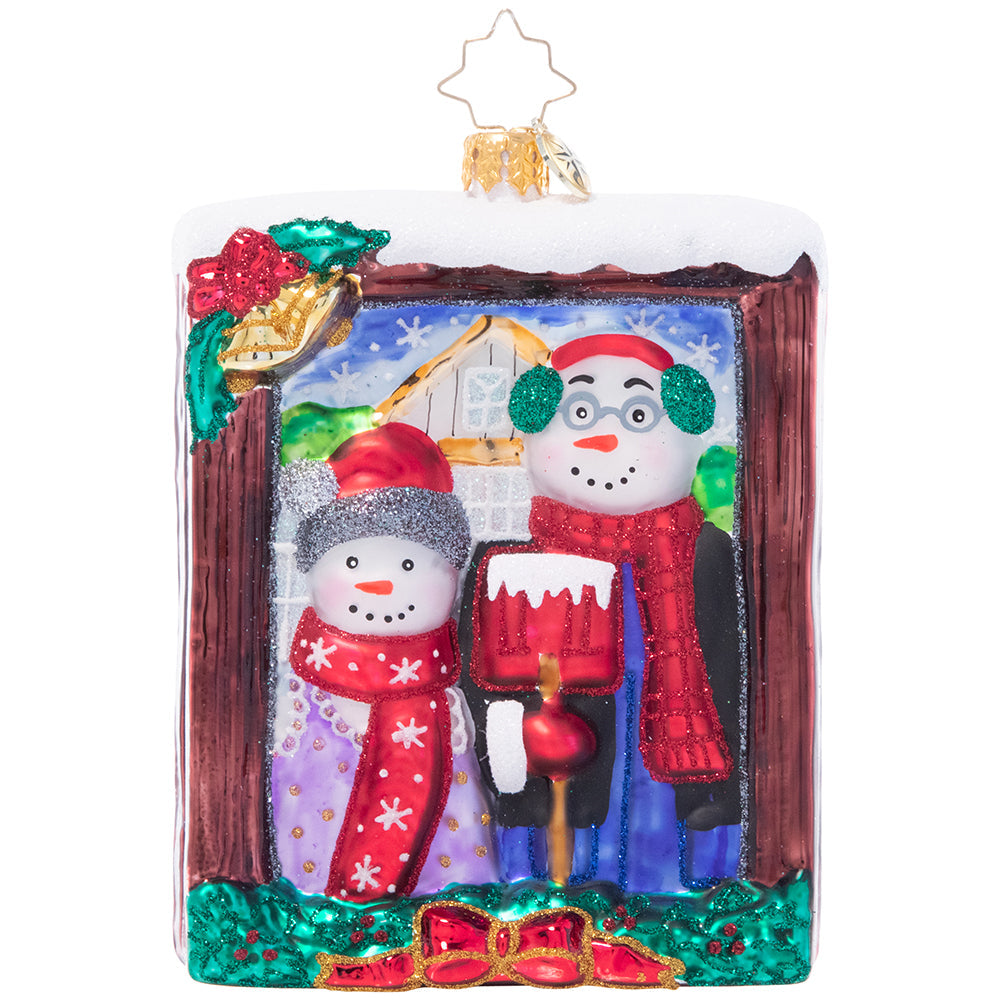 Ornament Description - A Moment in Time: Say cheese! This snow couple gives us their chillier--and cheerier!-- version of the iconic American Gothic painting.