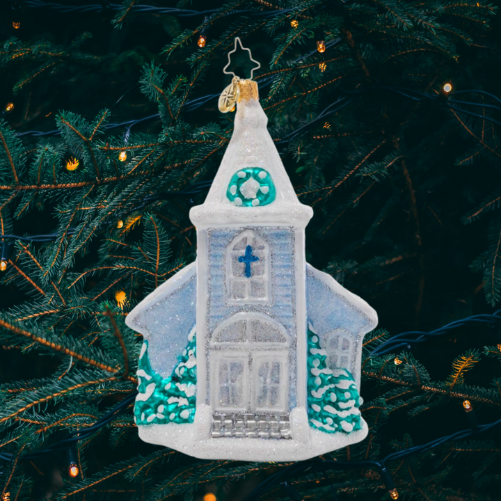 Ornament Description - White Christmas Chapel: Nestled in new-fallen snow, this glistening chapel is what white Christmas dreams are made of! Hang it from your tree to remind you of the warmth that comes from gathering together to celebrate the reason for the season.