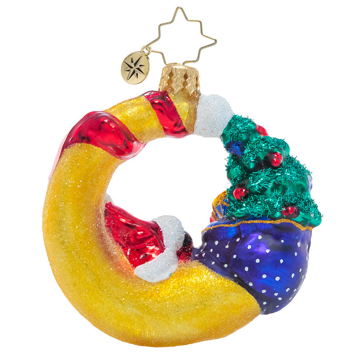 Back - Ornament Description - Over the Moon For Christmas Gem: Even Santa needs a break sometimes! He sets down his sack to lounge against a crescent moon to look down on the peaceful sleeping world and reflect on his hard work so far.