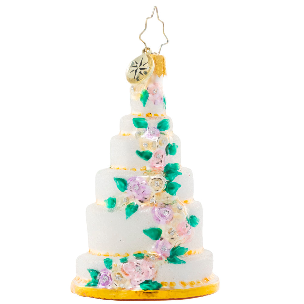 Front - Ornament Description - Six-Tier Celebration Gem: Be the envy of every baker with this towering tiered cake ornament. Decorated with a cascade of colorful spring blooms, it's lucky that it's the kind of cake that will last year after year because this piece is almost too beautiful to eat!