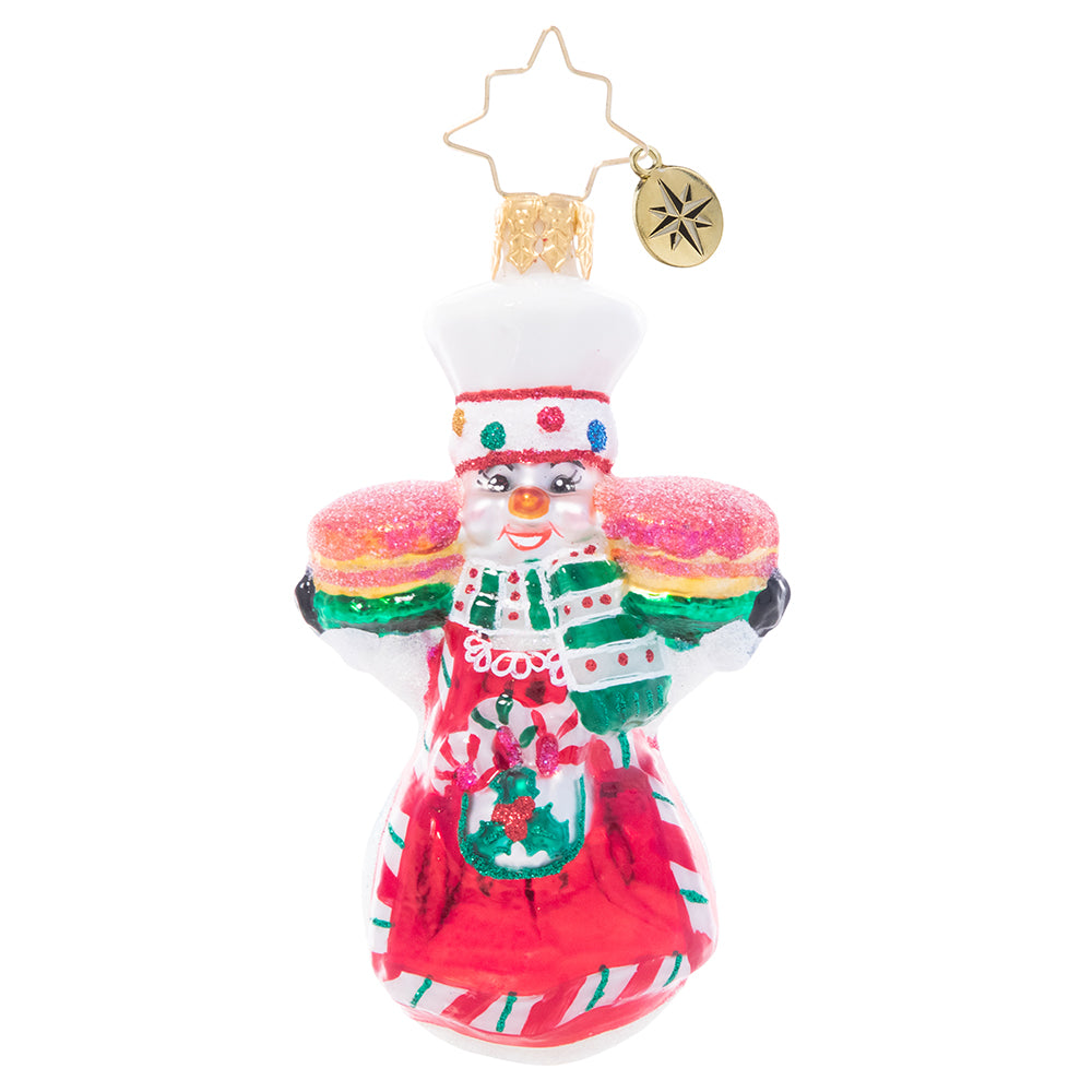 Ornament Description - This Christmas Takes The Cake Gem: A jolly snowman baker shows off his tasty holiday treats fresh from the oven. Come and get it!