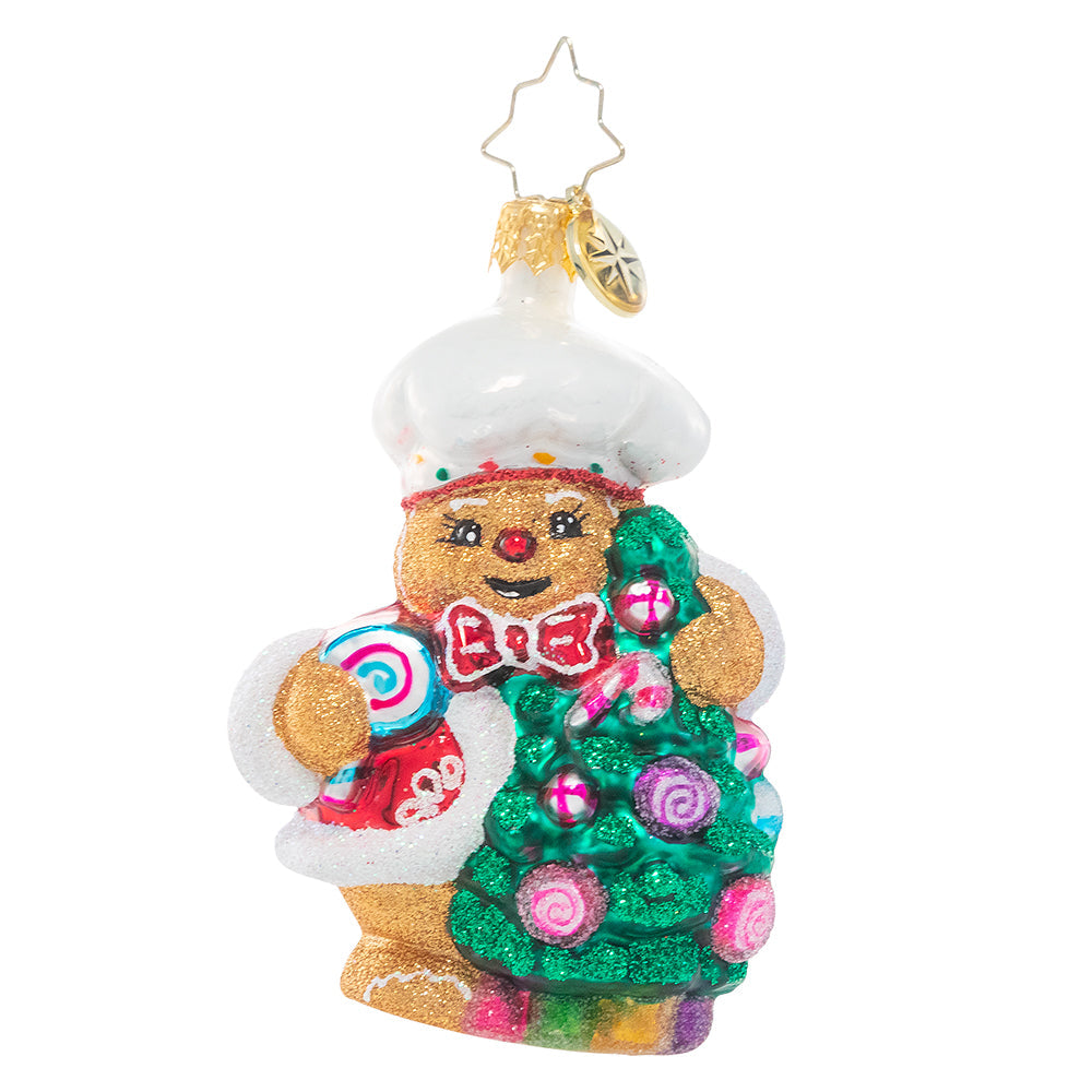 Front - Ornament Description - Edible Evergreen Dream Gem: This smiling gingerbread baker has whipped up a batch of his specialty – Christmas candy ornaments for his tree! He can't wait to celebrate his favorite season with all his gingerbread friends!\