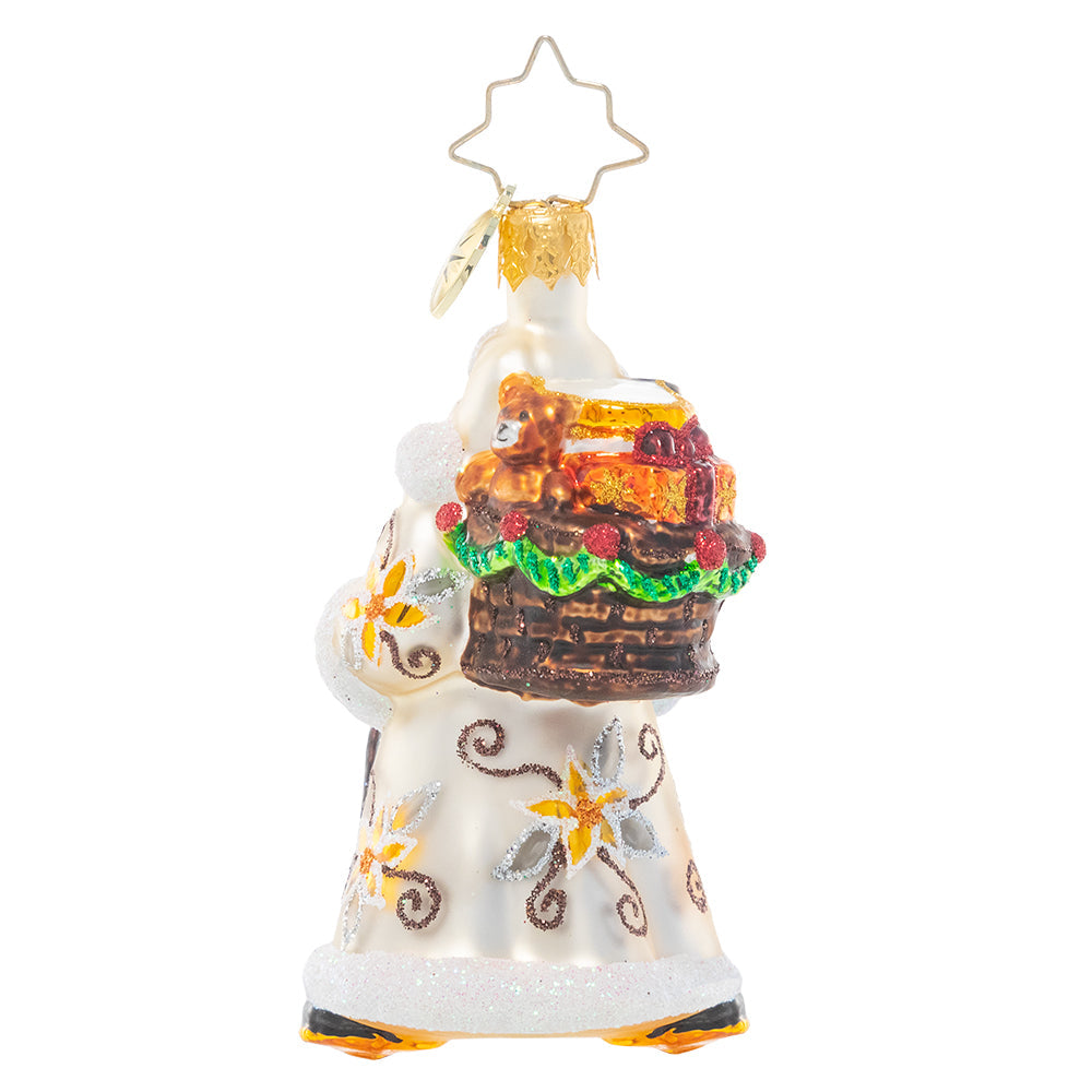 Back - Ornament Description - Bountiful Basket Traveler Gem: Dressed in wintry white and carrying a basket of sundries, Santa looks ready for a long trek. It's a snowy one out there, but luckily he's an expert North Pole navigator!