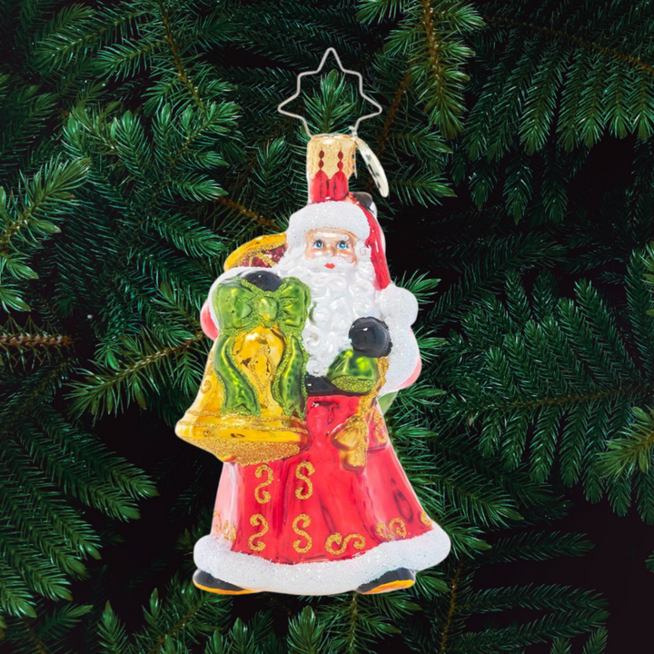 Ornament Description - A Christmas Melody Gem: Can you hear the sounds of Christmas? With a sack of instruments slung over his shoulder and bells in hand, Santa has everything he needs to be his own one-man Christmas band!