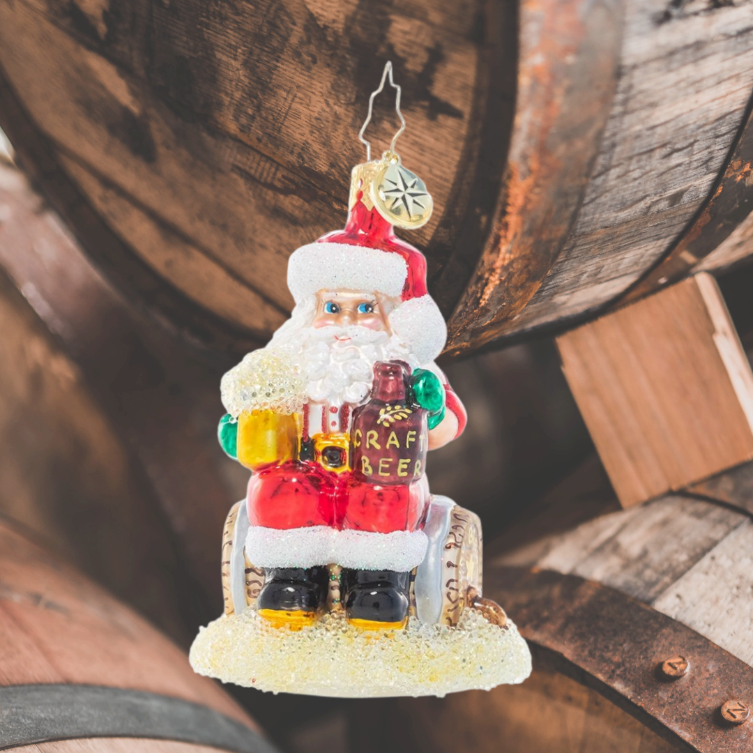 Ornament Description - Oktoberfest Cheers Gem: Prost! Santa's dug out his lederhosen, filled up his stein and made it to Oktoberfest, toasting to good times with great friends.