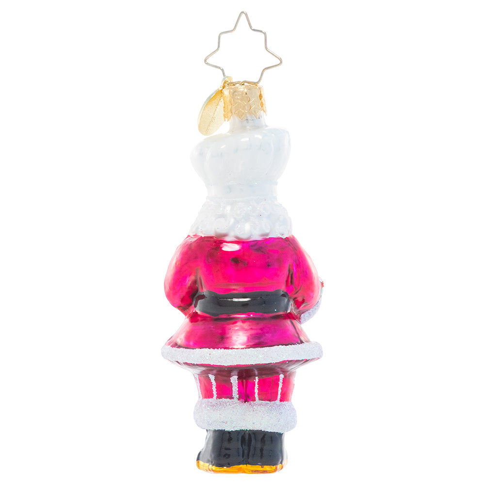Back - Ornament Description - Santa's Tower of Flour Gem: When Santa bakes, you know it's made with love – and a little Christmas magic! He's showing off his latest sweet creation from the North Pole bakery.