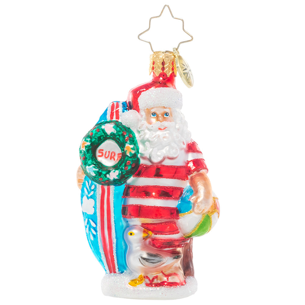 Front - Ornament Description - Wishing For Waves Santa Gem: Ho-ho-hang ten! Santa looks ready to catch a wave as he waits for the surf report holding his bright blue surfboard.