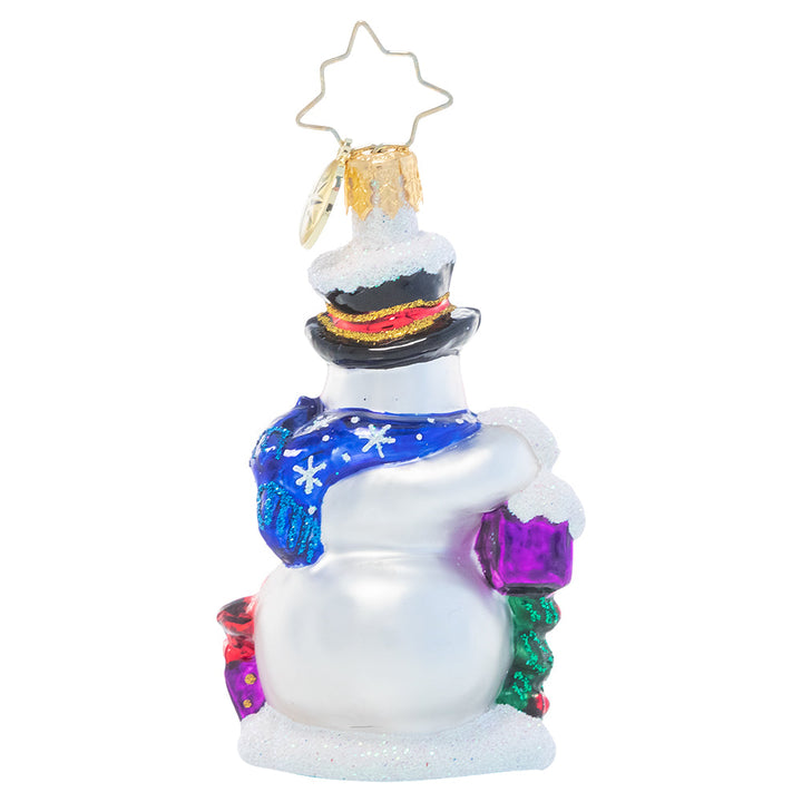 Back - Ornament Description - A Little Bird Told Me Gem: This tiny snowman has some extra help with his Christmas gift wrapping this year! He's enlisted the help of two bitty birdie visitors as he prepares presents for all his friends.