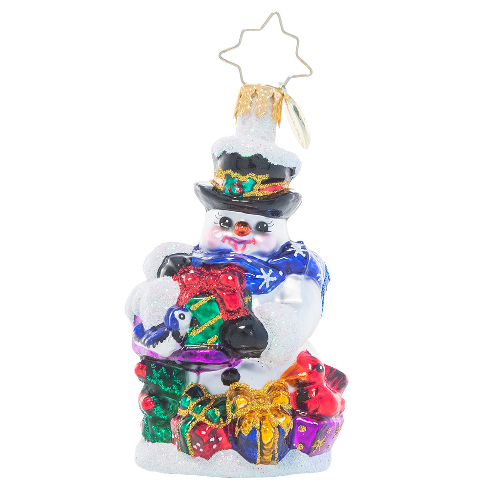 Ornament Description - A Little Bird Told Me Gem: This tiny snowman has some extra help with his Christmas gift wrapping this year! He's enlisted the help of two bitty birdie visitors as he prepares presents for all his friends.