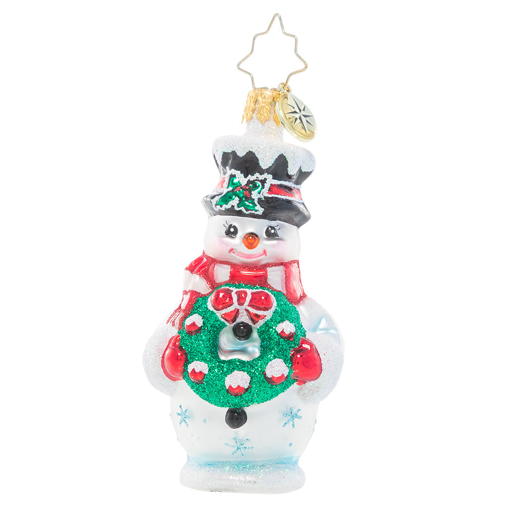 Front - Ornament Description - Darling Christmas Decorator Gem: This frosty snowman has been waiting all year long to deck the halls! He's fashioned his very own wreath and is excited to help his friends turn the town into a festive winter wonderland.