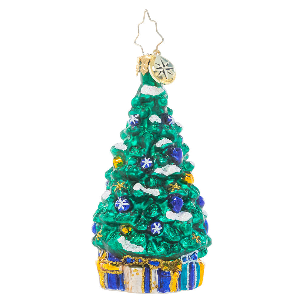 Front - Ornament Description - Shimmering In Sapphire Gem: This stylish tree is trimmed and ready for the big night, eschewing traditional red for a more subdued blue, white and gold. Presents tucked beneath the branches match the calm tones of the ornaments perfectly, completing the sophisticated look!
