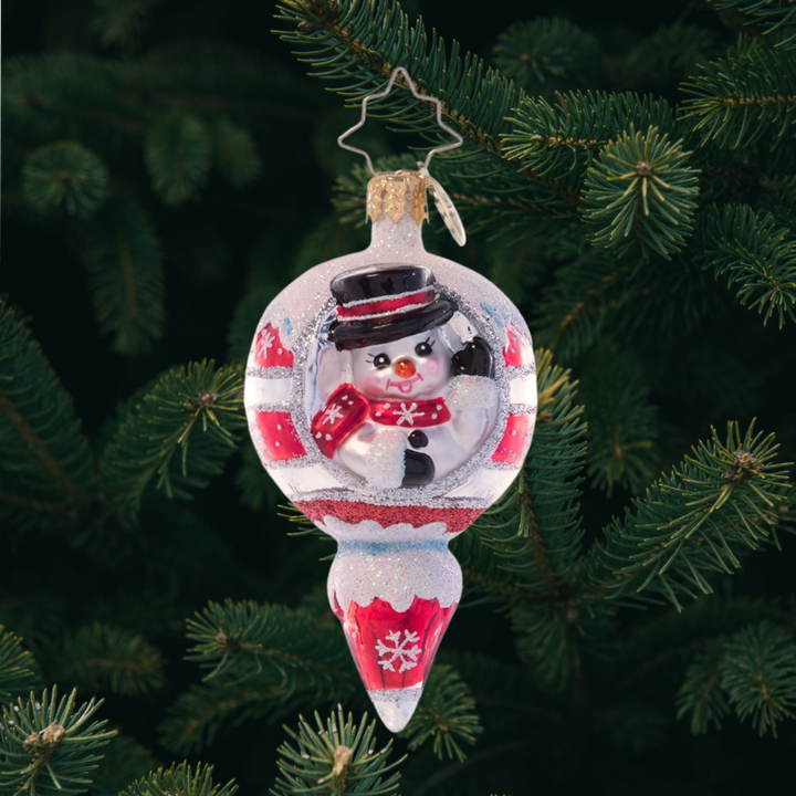 Ornament Description - A Frosty Hello Gem: A smiling snowman waves from within this cheery icicle ornament. Painted in holiday red and crowned with a dusting of sparkling snow, this vintage-inspired piece is the perfect way to add classic Christmas cheer to your tree.