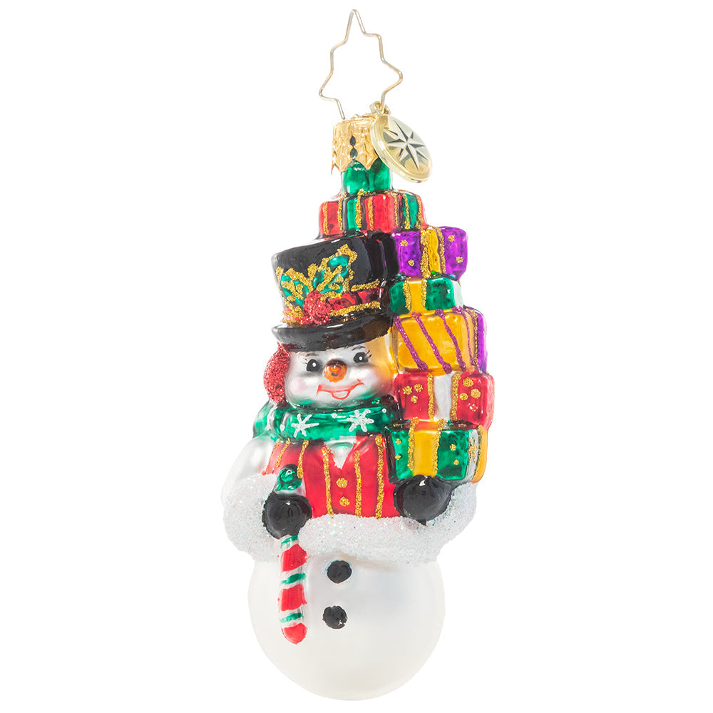 Front - Ornament Description - Savvy Shopper Gem: This snowman takes Christmas shopping very seriously! He's spent his day finding just the right gifts for everyone on his list – time to return home to put them under the tree!