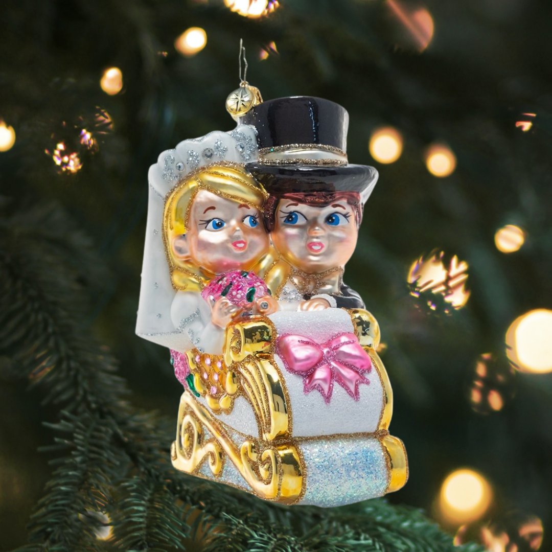 Ornament Description - Just Married Sleigh: They did it! This happy couple gets a sweet sendoff in an elegant sleigh decorated with a heart-shaped "Just Married" sign.