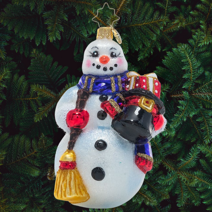 Ornament Description - Smiling Snow Friend: This happy snowman has taken off his top hat and filled it with presents. What kind of merry-making will he get up to once he delivers them?
