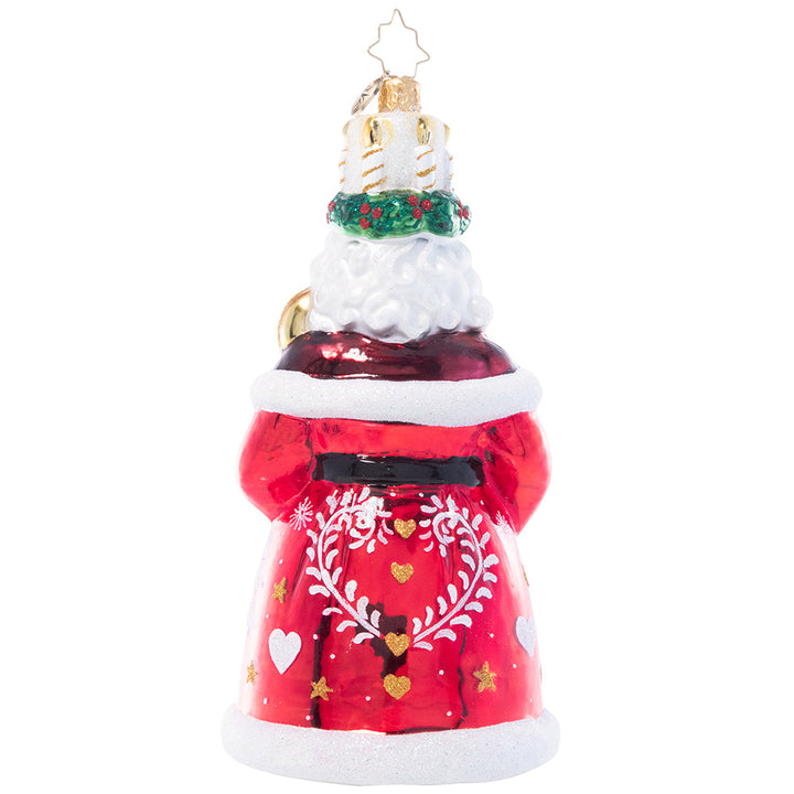 Back - Ornament Description - God Jul Santa: This Santa wears a crown of candles and a shiny red robe adorned with a delicate white pattern reminiscent of traditional Nordic Christmas motifs, paying homage to the Scandinavian feast of Santa Lucia.