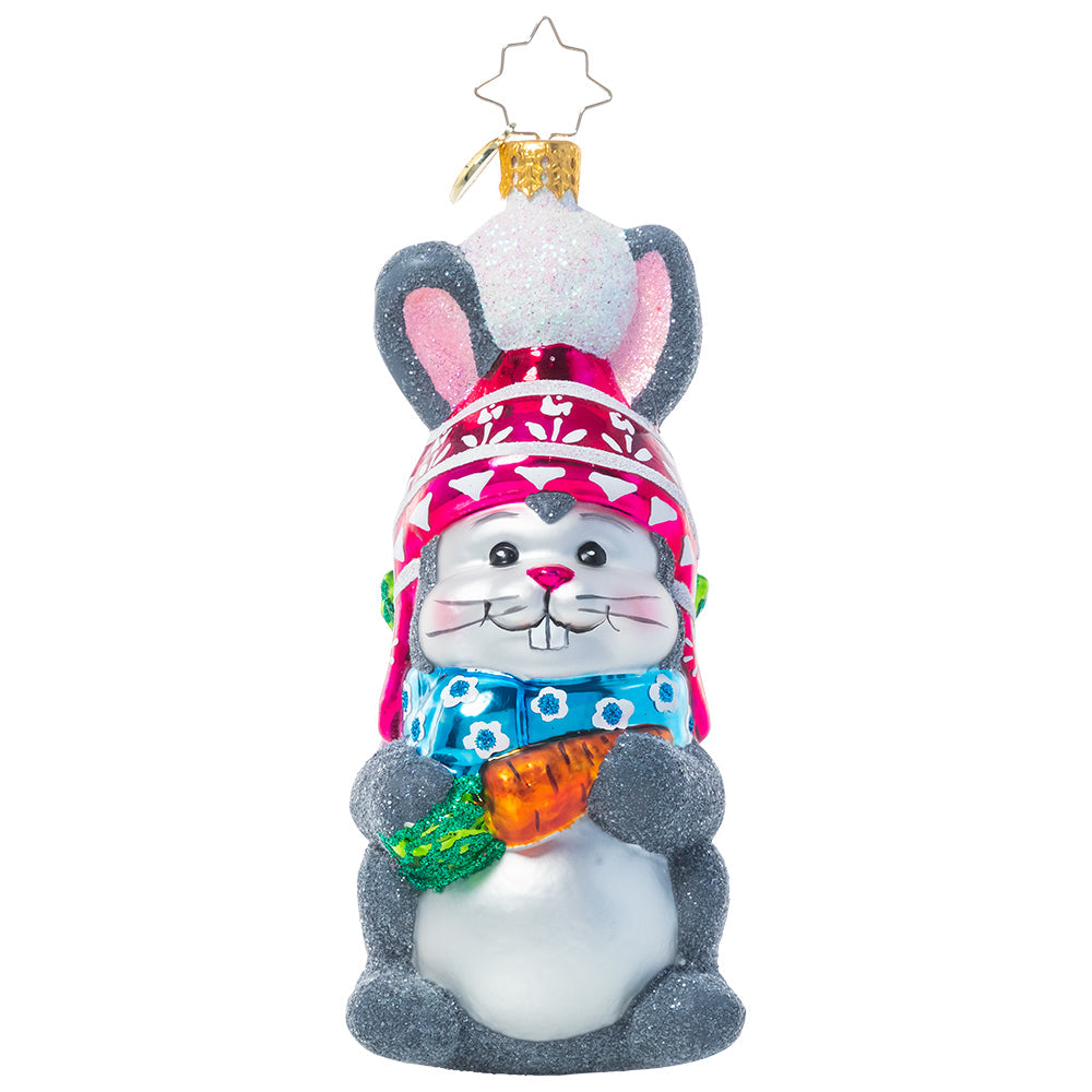 Front - Ornament Description - Bundled Up Bunny: This little cotton tail looks ready to hit the slopes with his snow hat and a bag full of provisions from the garden. All he needs now are some skis!