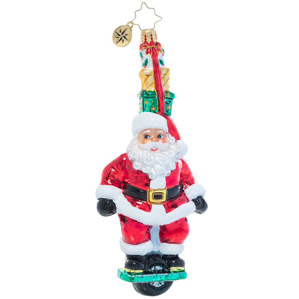 Front - Ornament Description - One Wheelin' Santa: Proving you're never too old to learn new tricks, Santa expertly rides a single wheel while balancing a stack of gifts on his head. Is there nothing this guy can't do?