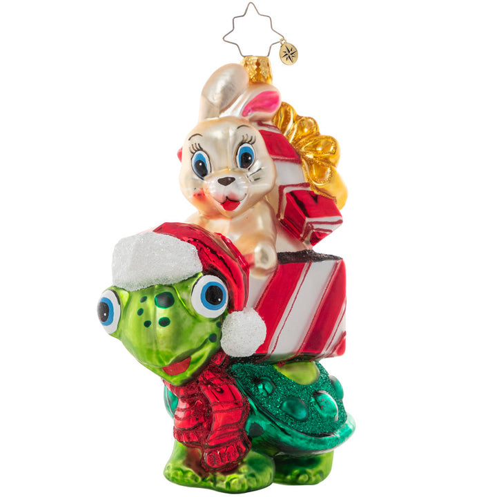 Front - Ornament Description - Race to The Finish:You know what they say…slow and steady wins the race! A tortoise and a hare team up for some Christmas time fun, racing to deliver gifts to their destinations!