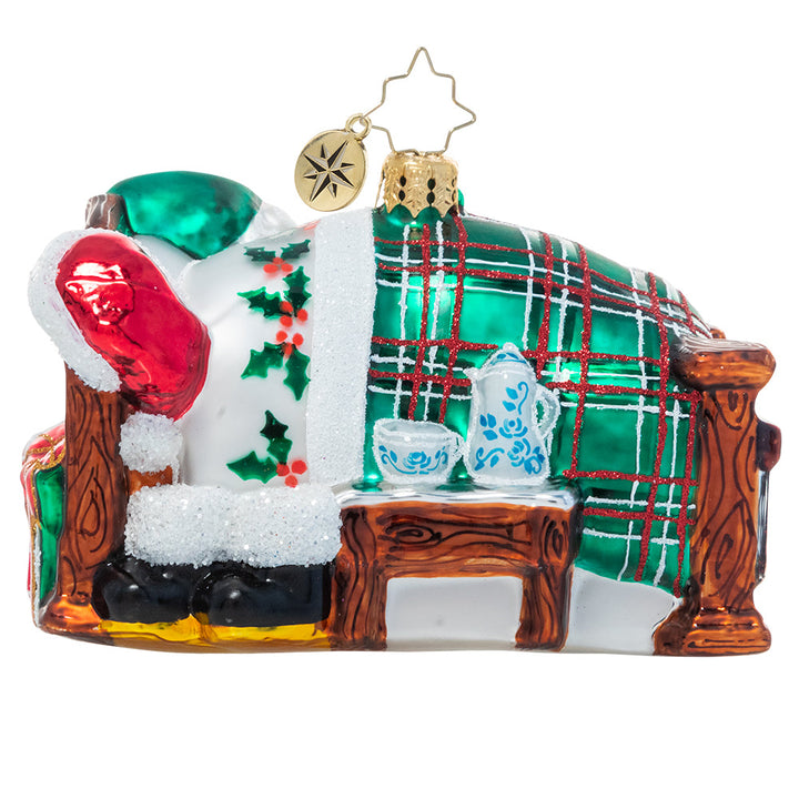 Back - Ornament Description - Catching Z's Mr. Claus: The holiday season is a busy one, and no one knows that better than Santa Claus! After his last Christmas Eve delivery is complete, he settles in for a well-deserved long winter's nap..