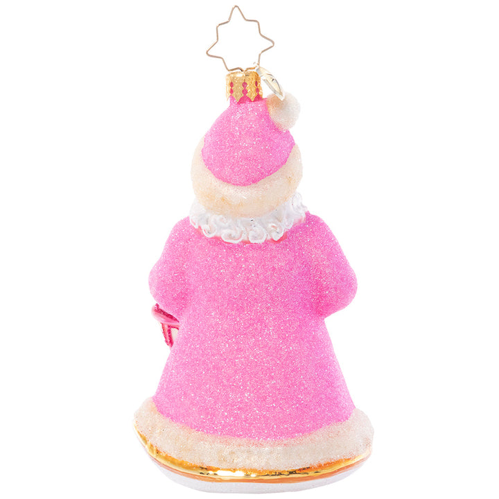 Back - Ornament Description - Donned in Pink: Cloaked in sparkling pink from head to toe, this Santa looks as sweet as sugar as he lights the way through a snowy winter's night.