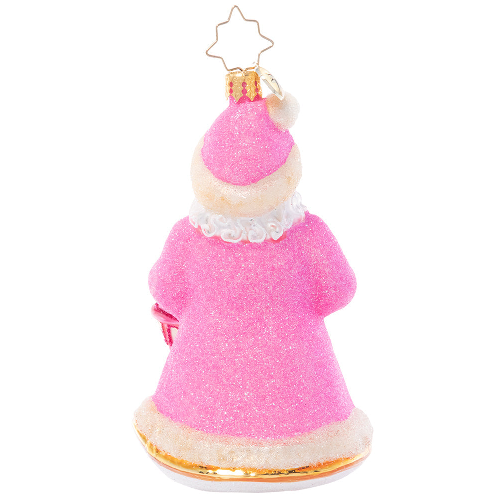 Back - Ornament Description - Donned in Pink: Cloaked in sparkling pink from head to toe, this Santa looks as sweet as sugar as he lights the way through a snowy winter's night.
