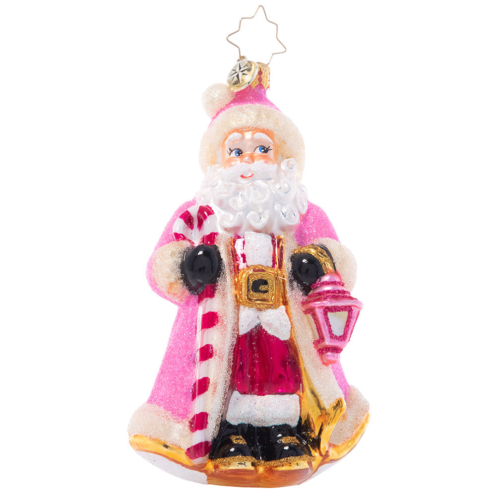 Front - Ornament Description - Donned in Pink: Cloaked in sparkling pink from head to toe, this Santa looks as sweet as sugar as he lights the way through a snowy winter's night.