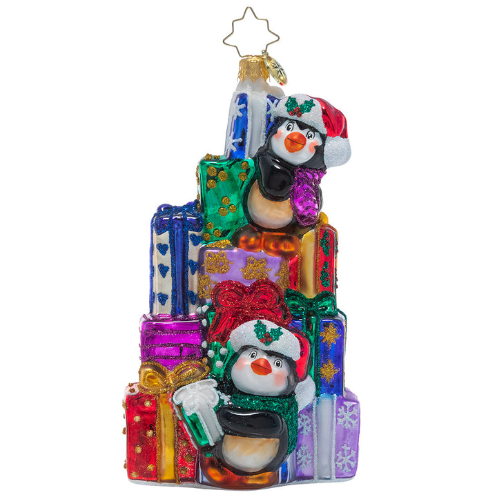 Front - Ornament Description - Santa's Little Helpers: A team of tiny penguin pals are giving the elves a day off, pitching in to help Santa stack the last of his present pile in preparation for Christmas Eve.