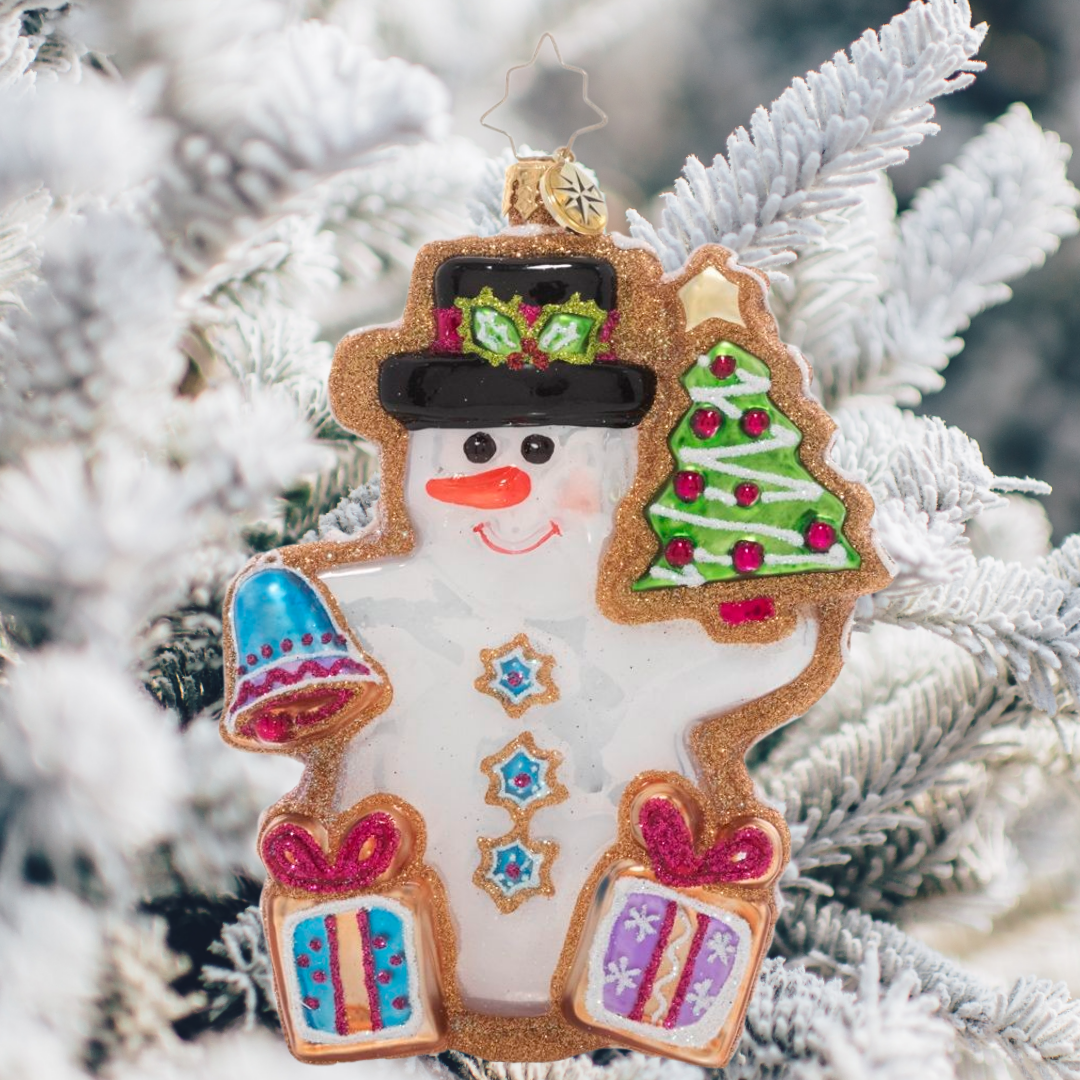 Ornament Description - Gingerbread Snowman: Fresh from the oven, this darling gingerbread snowman smiles in royal icing. He aims to make the season a little sweeter with Christmas cookie gifts, bells, and trees for all!