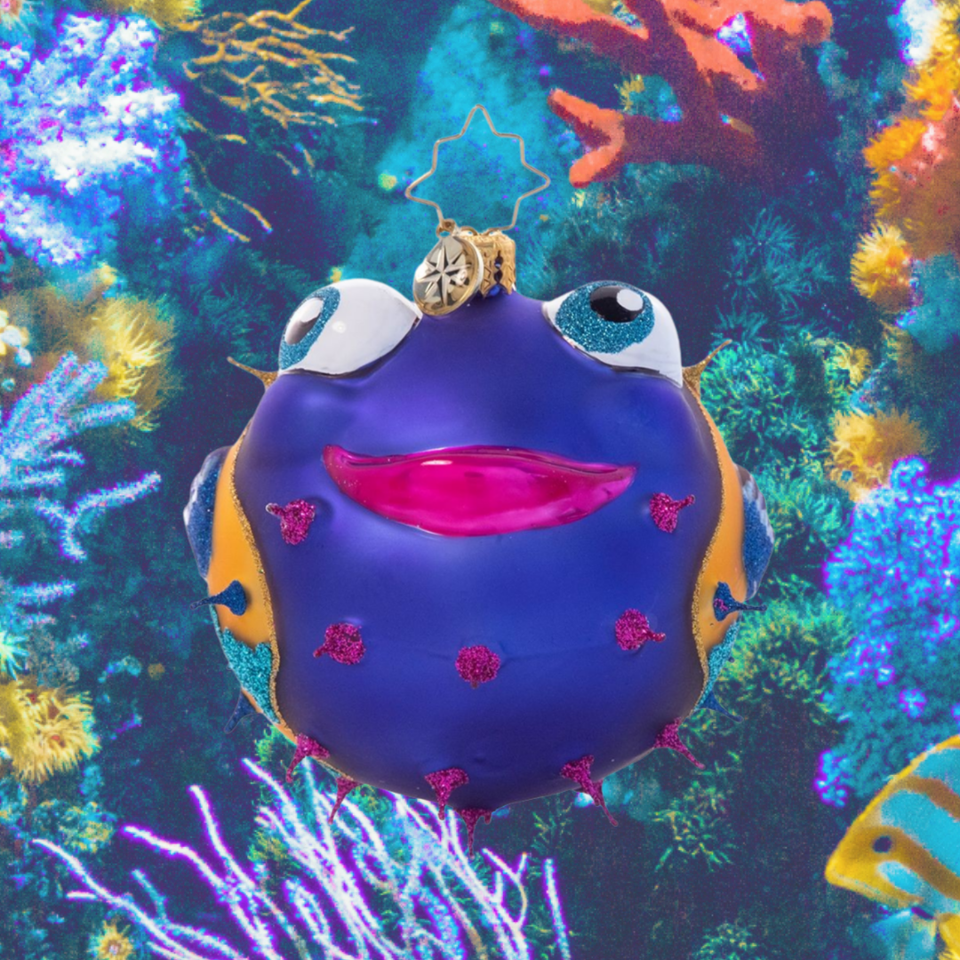 Ornament Description - All Puffed Up: Poof! This colorful pufferfish is all smiles as she shows off her secret talent. Hang her on your tree for a touch of tropical flair!