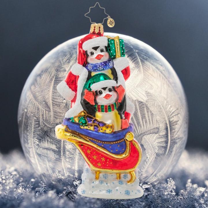 Ornament Description - Silliest Sleigh Ride: A pair of polar pals is up to their tricks again, playing a little dress-up as they load Santa's sleigh for round-the-world deliveries. Good thing Santa has a sense of humor!