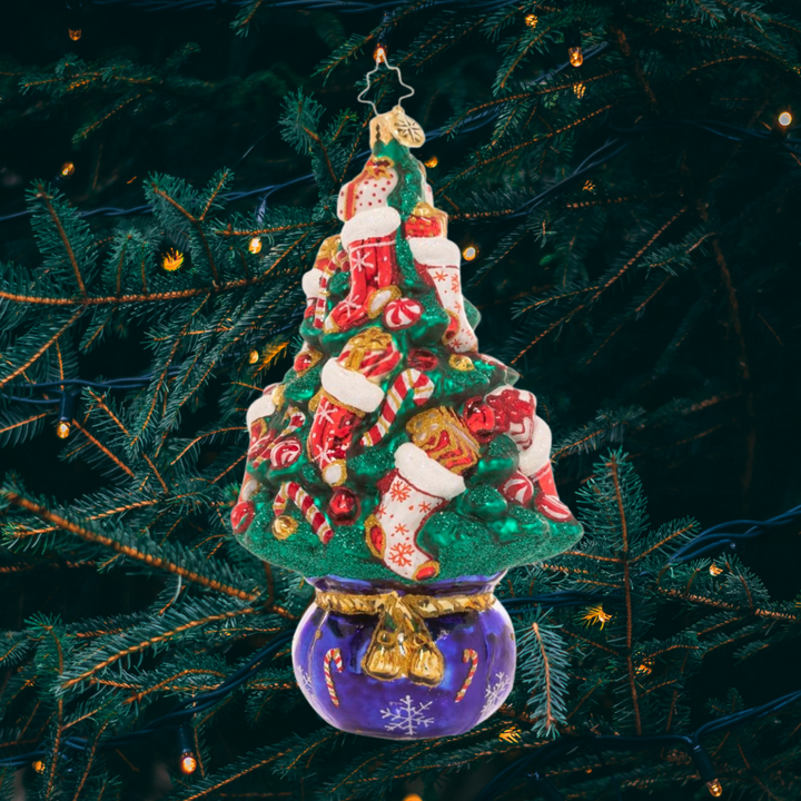 Ornament Description - Candy Cane Conifer: This handsome holiday tree gets a bit of a peppermint twist with candy cane-themed ornaments. Pops of swirled red and white accent the deep green of the branches for a classic Christmas look!